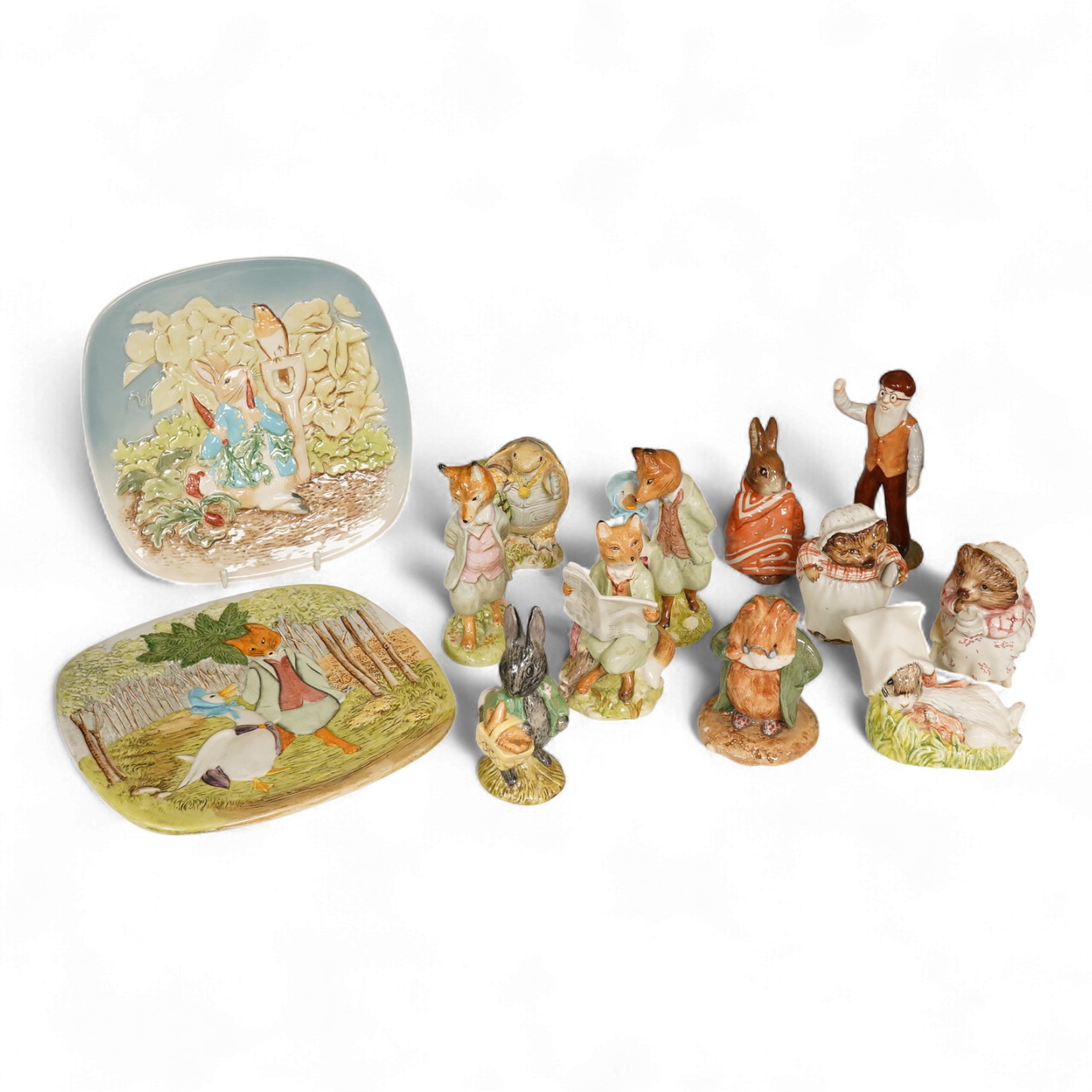 A collection of Beswick and Royal Albert Beatrix Potter figures to include Little Black Rabbit and The Head Gardener, together with two plates, 19cm wide